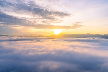 Fototapeta na wymiar Sunrise and sea of fog, view from AIYERWENG View Point at Yala, Thailand