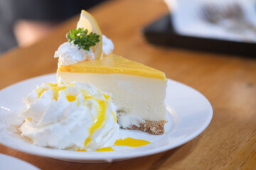 Tasty lemon cheesecake decorated with lemon slice