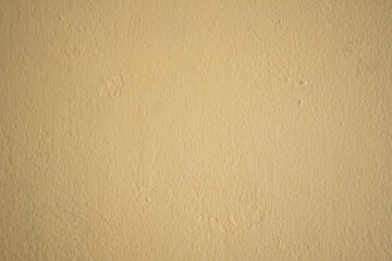 Fototapeta na wymiar A well-done light yellow wall texture background.