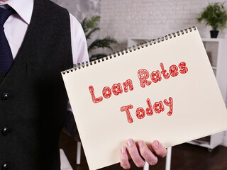 Business concept meaning Loan Rates Today with sign on the piece of paper.