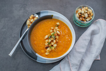 Pumpkin soup. Vegetarian soup in bowl on wooden table