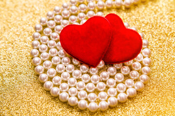 Heart symbol on a gold shiny background
