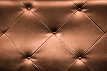 Orange leather upholstery of  sofa for texture