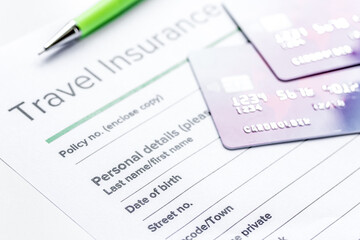 Traveling concept with insurance application on white table