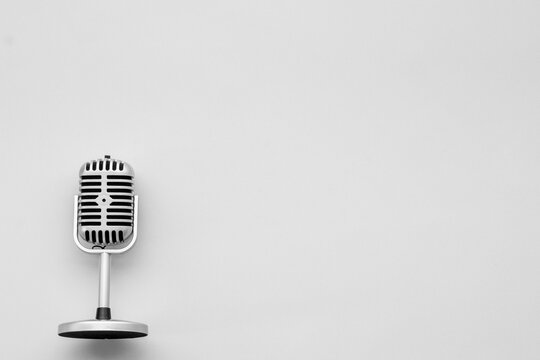 Flat lay of retro classic microphone with space for text