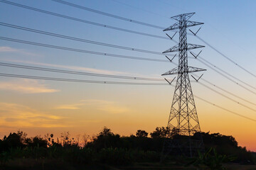 Fototapeta na wymiar High voltage pole And sunset