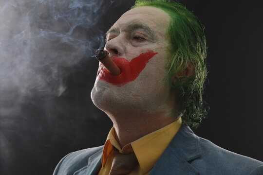 Men In Joker Mask With Cigar