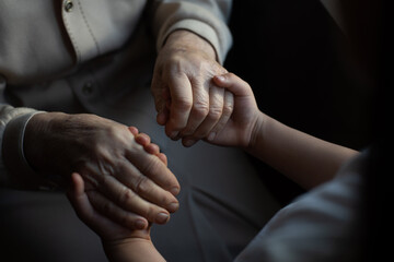 Obraz na płótnie Canvas Aging process - very old senior woman hands wrinkled skin