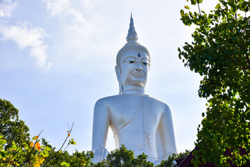 Big white Buddha statue in thai.