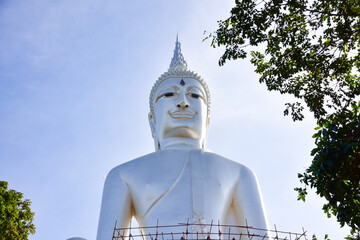 Big white Buddha statue in thai.