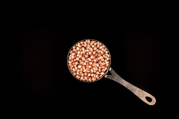 Raw Popcorn on Black Background