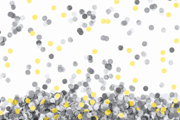 Yellow and gray confetti isolated on white background. Banner.