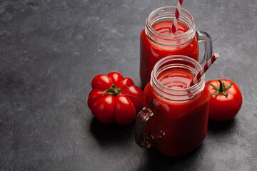 Fresh tomato juice and ripe tomatoes