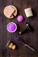 Fototapeta na wymiar Flat lay of lavender cosmetics - bath salt and essential oil, top view