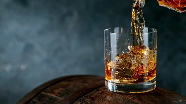 Pouring whiskey on barrel in super slow motion. Shot with high speed cinema camera, 1000fps.
