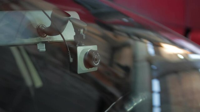 Dash cam recorder view through the car windshield camera movement
