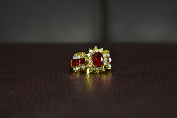 Gold ring with garnet and diamond