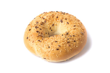 Traditional whole wheat bagel with linseeds and sesame seeds isolated on white