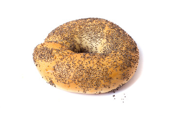 Traditional whole wheat bagel with with poppy seeds isolated on white