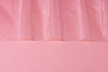 Pink shiny organza fabric close up. Abstract background.