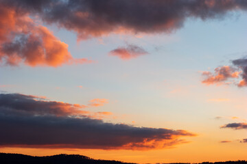 Fototapeta na wymiar Dramatic blue sky during sunset blue pink and dark violet clouds