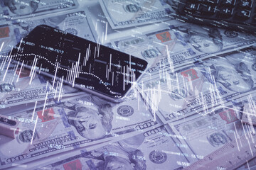 Obraz premium Double exposure of forex graph drawing over us dollars bill background. Concept of financial markets.