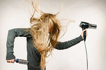 Girl styling her long hair