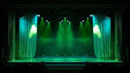 An empty stage of the scene concert hall, lit by spotlights and smoke 