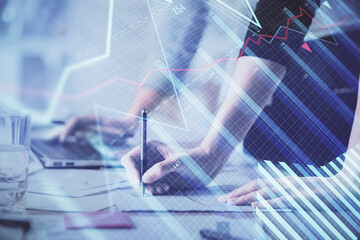 Multi exposure of woman hands typing on computer and financial chart hologram drawing. Stock market analysis concept.
