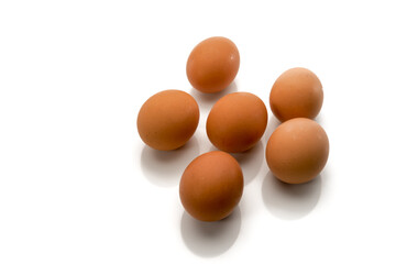 eggs isolated on white background, six brown chicken eggs, half a dozen in top view, text space
