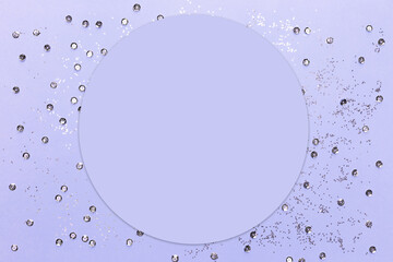 Lilac background with silver sequins and shining paillettes with copy space. Greeting card. Mock up.
