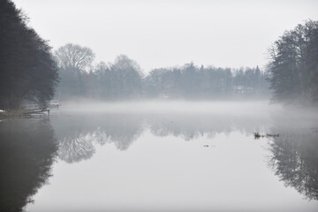 Fototapeta premium Autumn landscape. Foggy day over the waterline.