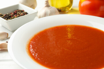 Concept of tasty dinner with tomato soup, close up