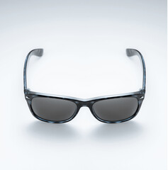 Black and dark blue sunglasses isolated on a white background, classic model, eye fashion, product photo
