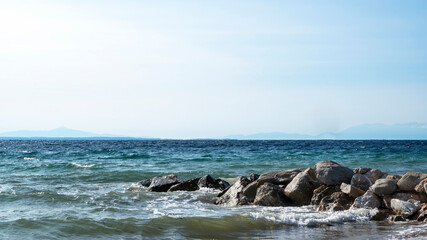 Fototapeta na wymiar Rocks on the Aegean sea coast in Greece