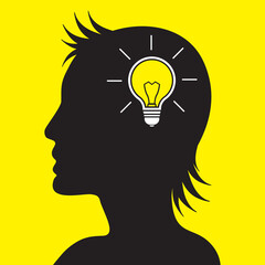 Silhouetted woman head with light bulb inside. Creativity or New ideas concept