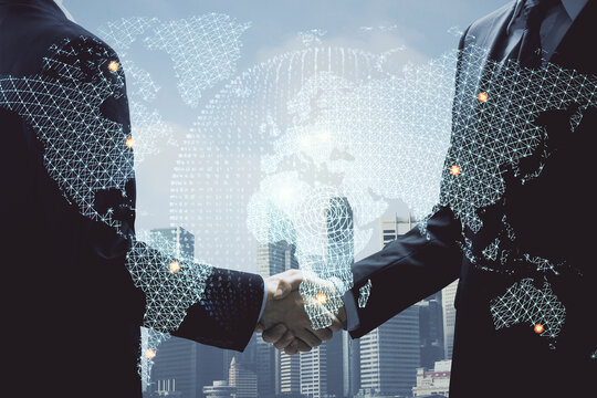 Double exposure of business theme hologram and handshake of two men. Success concept.