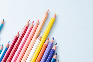 Colorful pencils in the case isolated on the gray background.