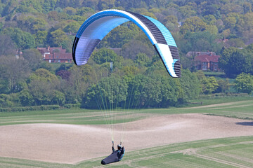 Paraglider flying at Combe Gibbet, England