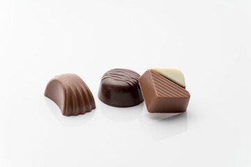 Closeup shot of tasty chocolate candies on white background