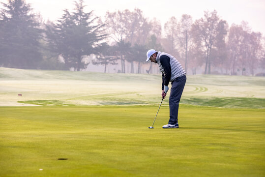 Golfer playing golf on the golf course during a winter day