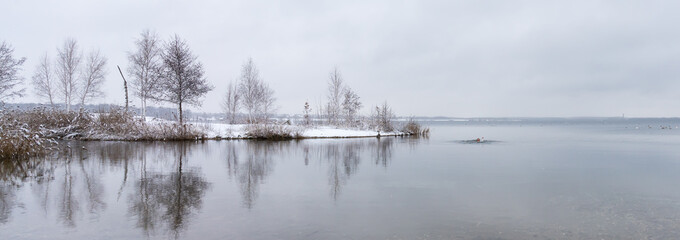 Ice swimming in a snowy lake in winter