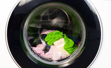 Washing machines and colorful fabrics The washing machine is running set in the house.