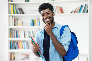 Smart young african american male student with beard