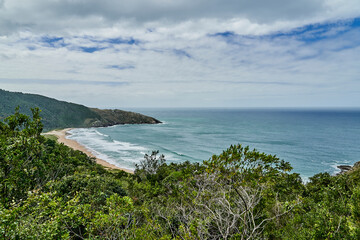 Fototapeta premium beautiful sand beach along the lonely and hidden lagoinha do leste, a small lagoon at the shoreline of the atlantic ocean on santa catarina island near Florianopolis, Brazil, South America