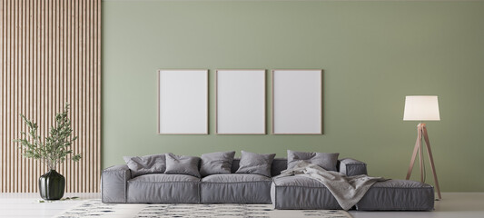 Modern living room design, gray sofa on green wall with three wooden frames mockup