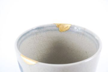 Detail Kintsugi restration, real gold wabi sabi Kintsukuroi, Japanese artisan work. Kintsugi, the...