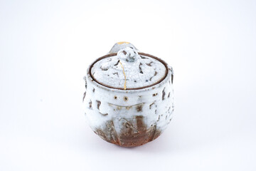 Antique Kintsugi, Japanese white traditional teapot, Gold cracks Kintsugi, Kintsukuroi Japanese technique.
