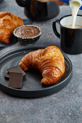 Lush chocolate croissant and black cup