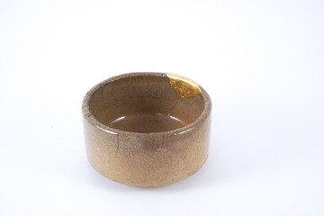 Antique Kintsugi  Japanese beige sake cup, , Gold cracks Kintsugi, Kintsukuroi Japanese technique.
